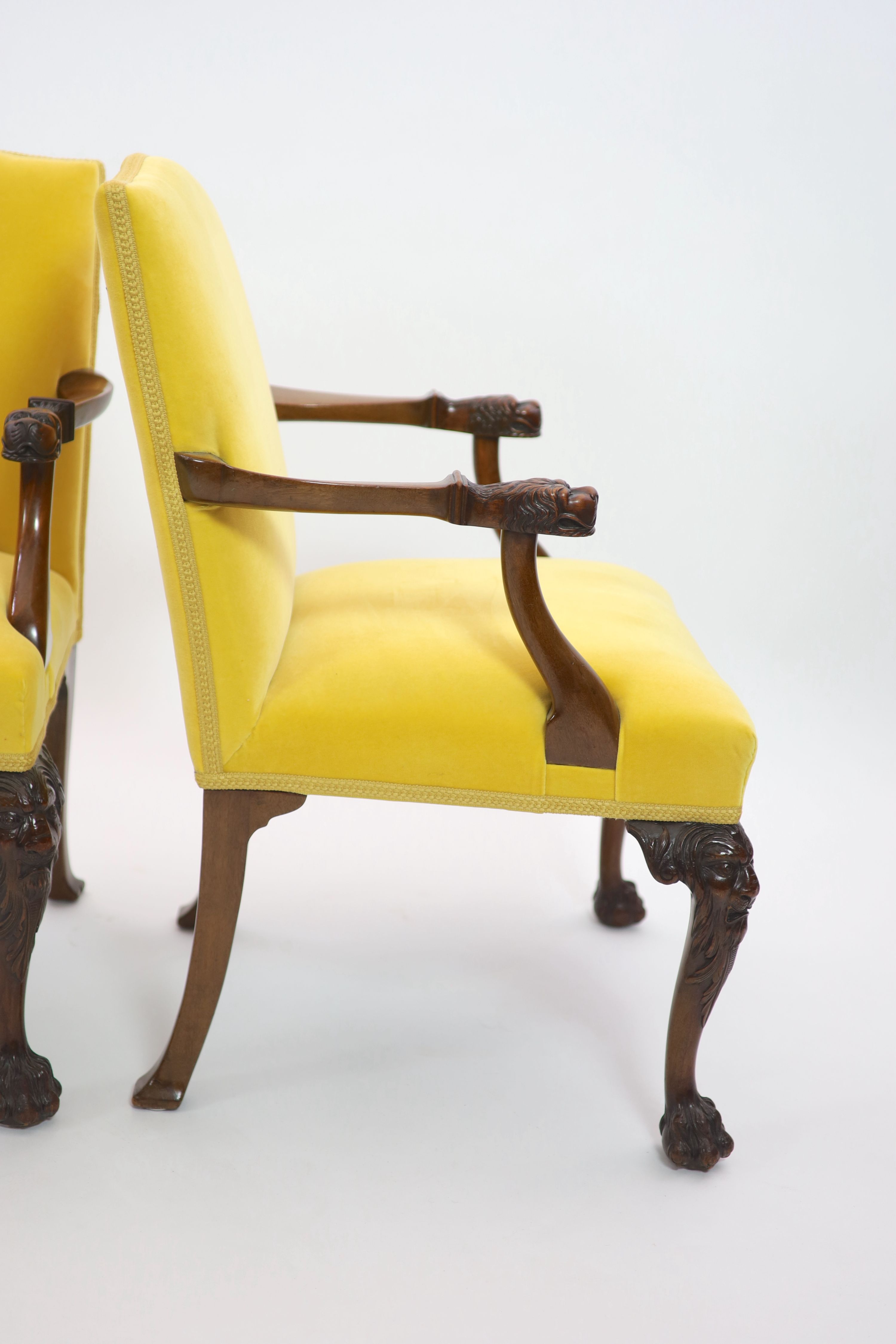A pair of George II style mahogany elbow chairs, W.60cm D.60cm H.91cm